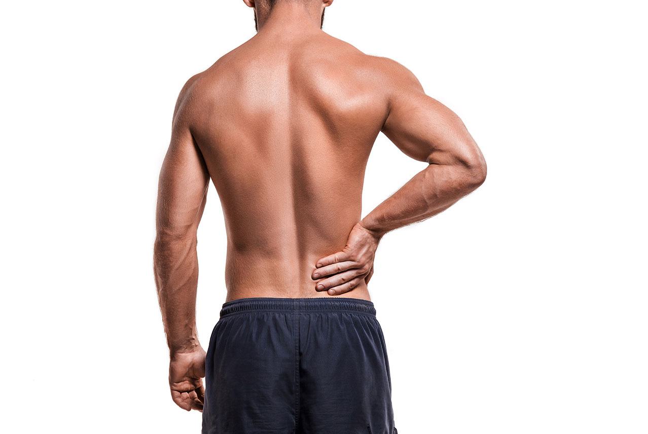 Shirtless man with back pain